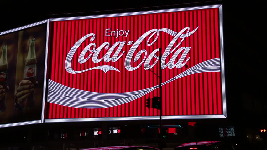 The Flashing Neon Sign Of The Coca-Cola Billboard In Kings Cross ...