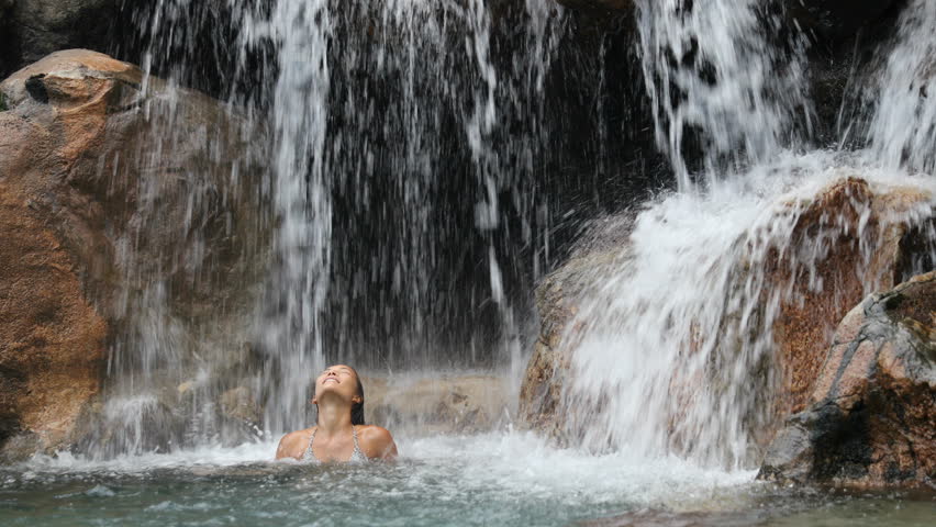 nude curvy art model waterfall background