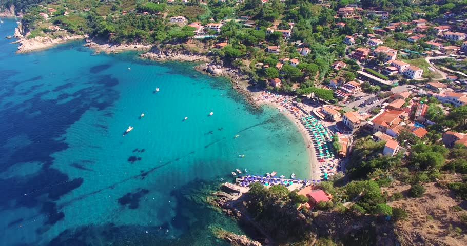 Fly over Sant Andrea, Elba, Italy, on a warm summer day. 
