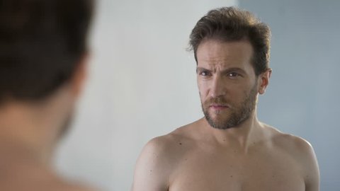Middle Aged Man Looking In Mirror Stock Footage Video 100