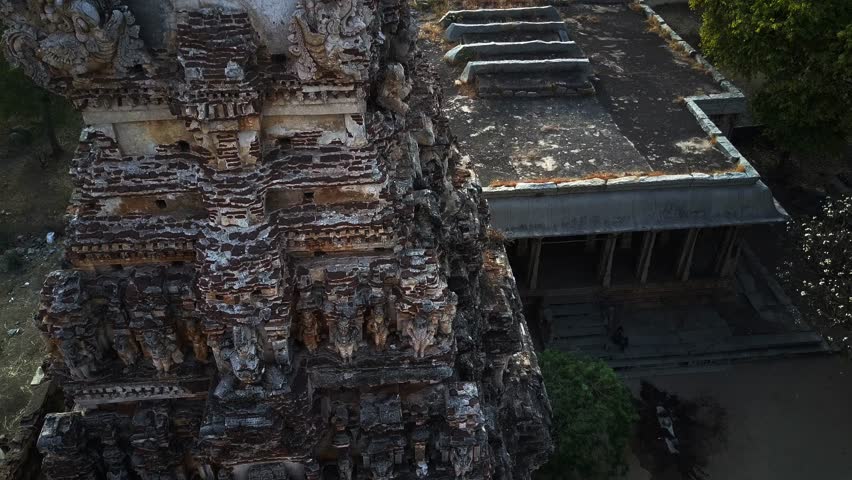 Flight over Sri Hanuman temple, Hampi, Karnataka, India. Monkeys running on the side walls.
