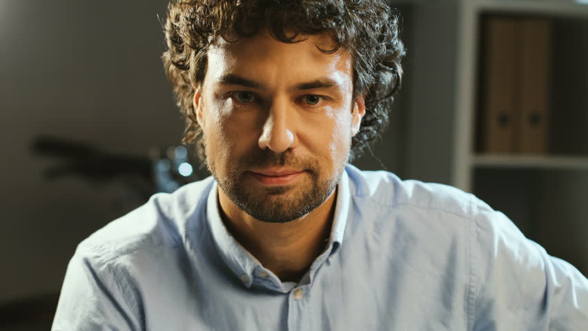 4k00 12portrait Of Handsome Man With Curly Hair Looking To The