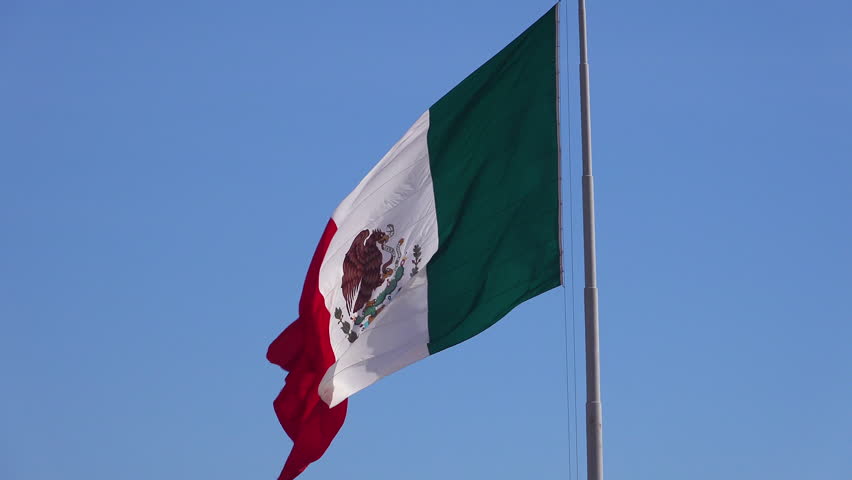 The Flag Of Mexico Flying High Above Tijuana Mexico At The US Border ...