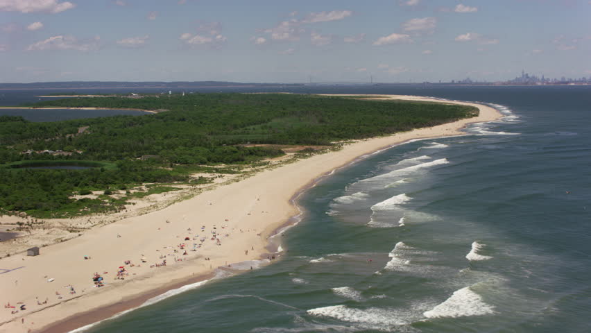 Aerial Flying Above A Calm Surf Beach Holiday Homes And Island New Jersey Circa 2017 Flying Up Sandy Hook Beach Towards York City