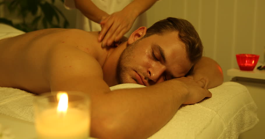 Attractive Young Man Relaxing At Beauty Spa Male Receiving Back Body Massage Attractive Young Man Relaxing At Beauty Spa Male Receiving Back Body Massage