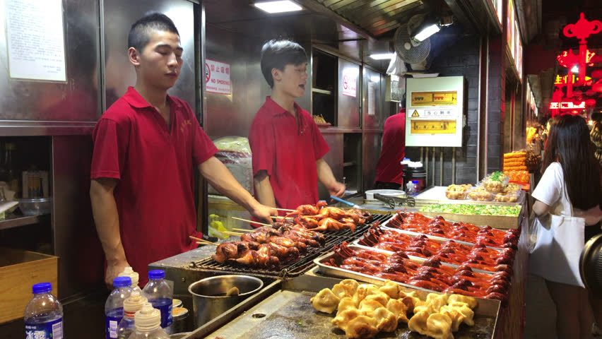 Traditional Jian Bing Being Grilled And Wrapped On Street Food Stand By ...