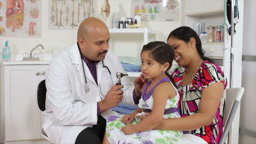 An Indian Pediatrician Or Family Doctor Listens To The Heart Of A ...