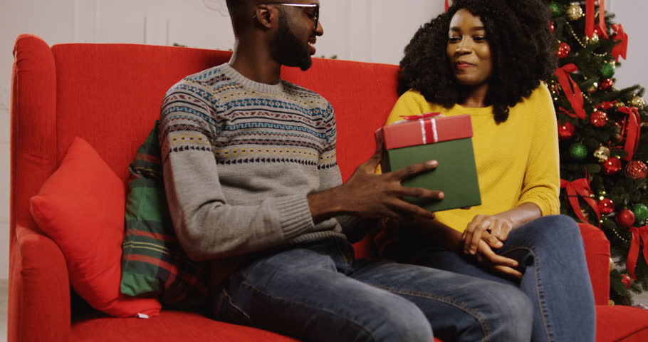 Image result for african giving a present to his girlfriend