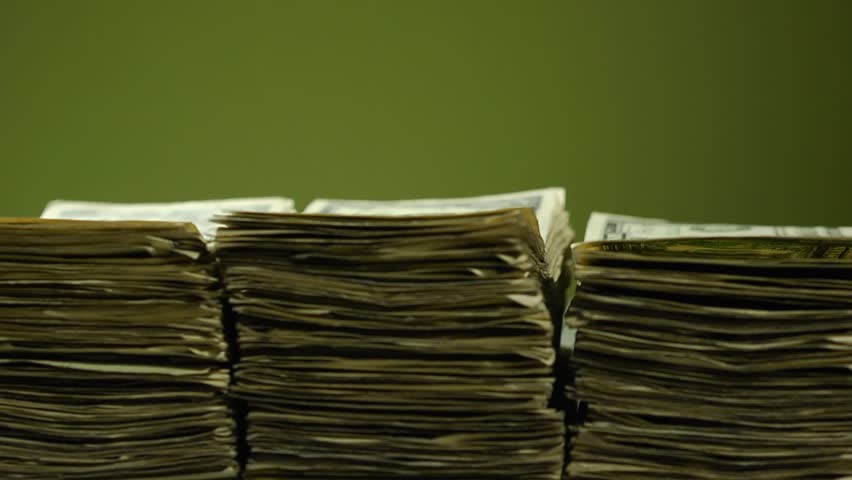 Money Grow & Shrink Timelapse
Three stacks of bills grows and shrinks in a loopable timelapse