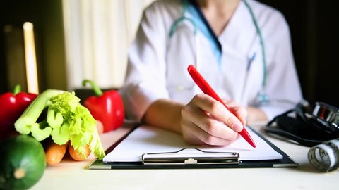 Vegetable diet nutrition and medication concept. Nutritionist offers healthy vegetables diet.