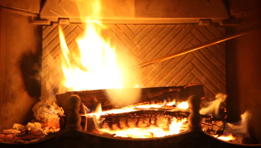 Round Logs Burn In Fireplace Stock Footage Video 100 Royalty Free Round Logs Burn In Fireplace Ancient Br Fire Iron Corrects Burning Coals Man Hand Puts Next Log Into Hd Video