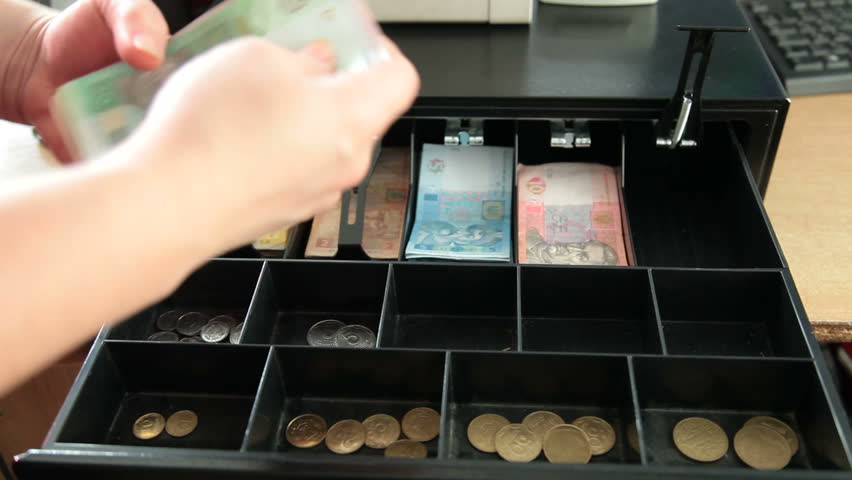 Cashier Counting Ukrainian Money Hryvnya From The Cash Register