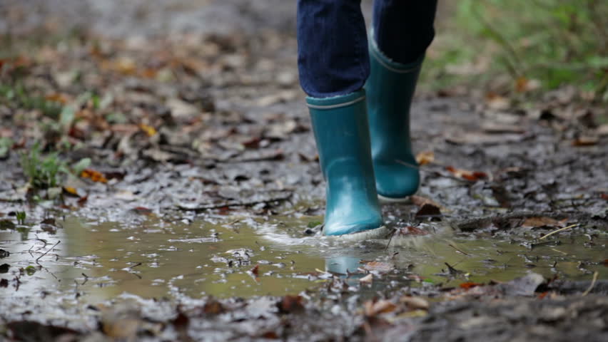 Rain Boots Walking In Mud Puddle And Dirt In Fall. Blue Woman Rain ...