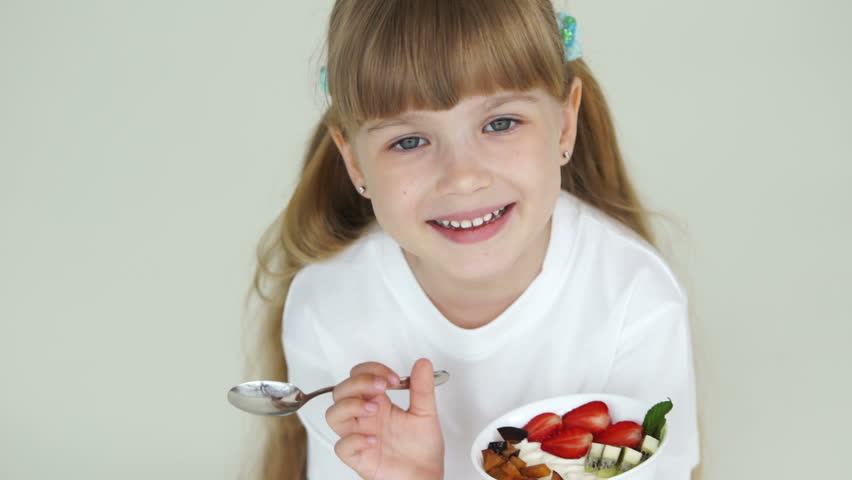 Sweet Girl Eating Yogurt With Fruits Stock Footage Video 4149943 ...