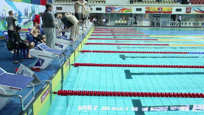 moscow apr 20 sportsmen jump into water during relay race of swimming in pool - Olympic Swimming Starting Blocks moscow apr 20 sportsmen jump into water during relay race of swimming in pool - Olympic Swimming Starting Blocks
