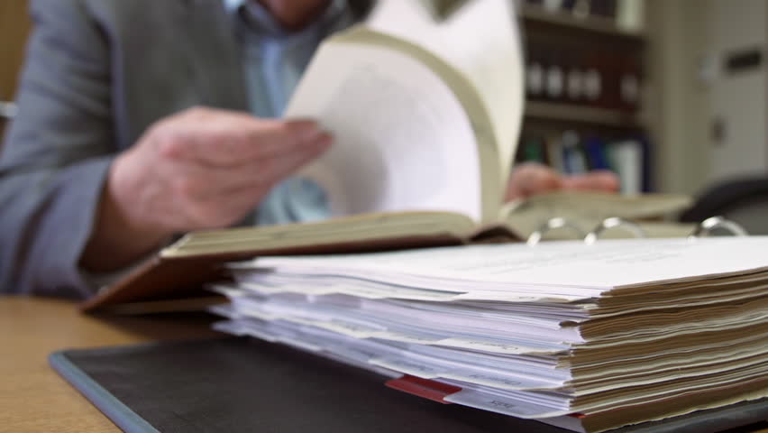 Man conducts legal research in library 
