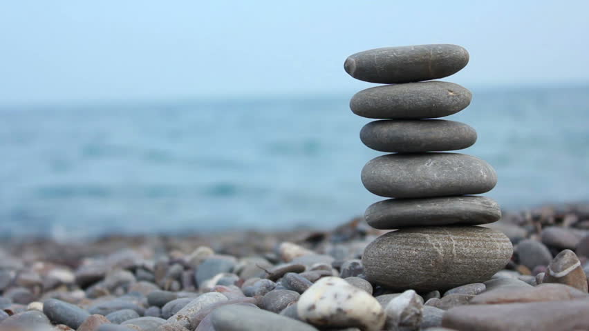 Pebble Stones Pyramid Stands On Stock Footage Video 100 Royalty Pebble Stones Pyramid Stands On The Beach