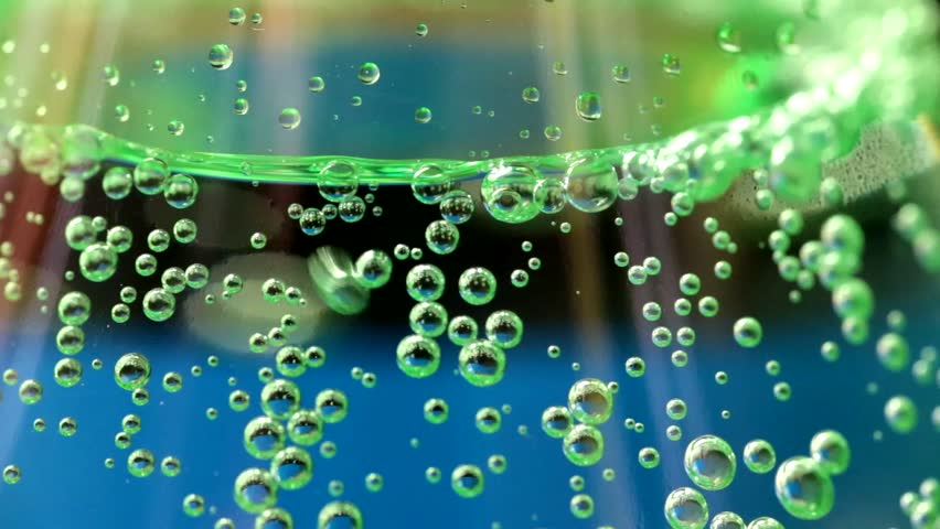 Stock Video Clip of Bubbles in fizzy water. Shallow depth of | Shutterstock