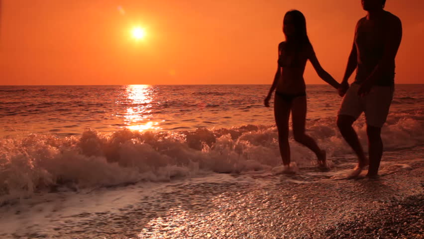 Young Walking Along Beach Stock Footage Video 100 Royalty Young Walking Along Beach Stock Footage Video 100 Royalty Free 5450762 Shutterstock