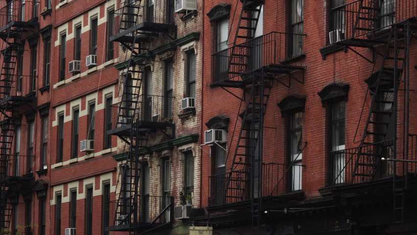 Apartment Building Exterior medium shot exterior of brick apartment building, new york city Apartment Building Exterior medium shot exterior of brick apartment building, new york city