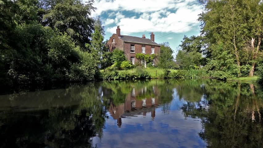 Stock video of old english farmhouse with large duck | 6882742