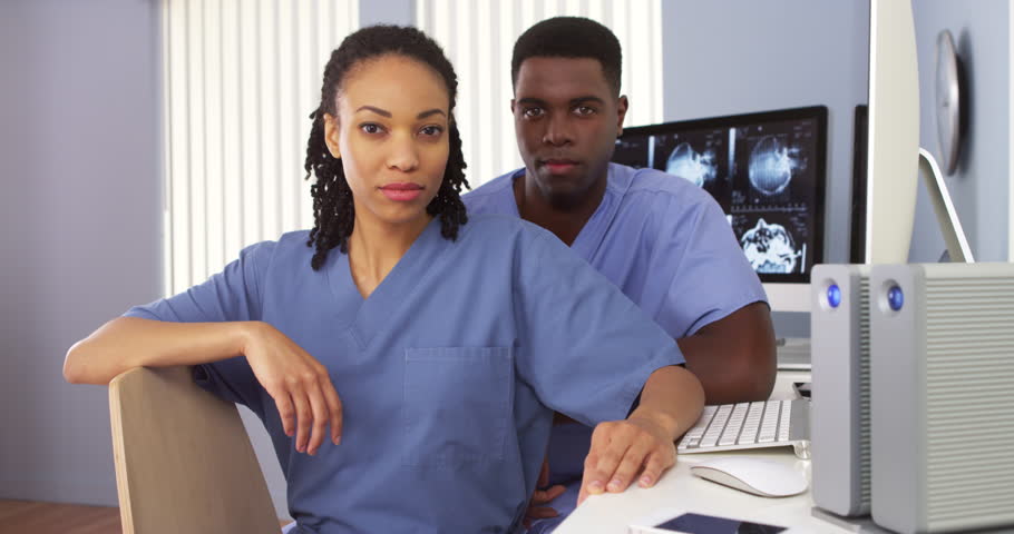 Two Black Doctors Sitting Together Stock Footage Video 100