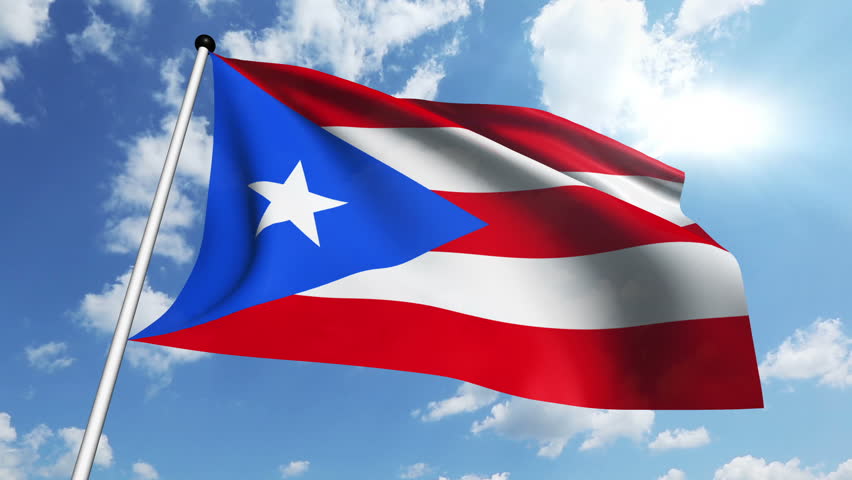 Flag Of Puerto Rico With Fabric Structure Against A Cloudy Sky