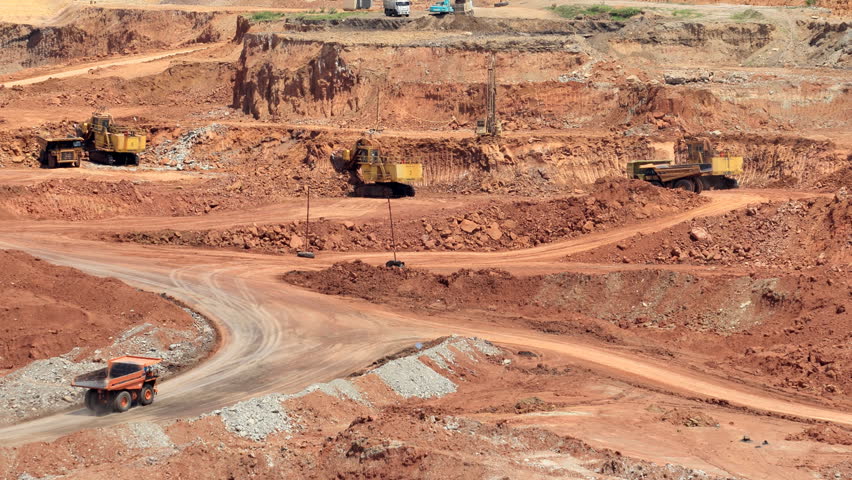 Mining Dump Trucks And Excavators In The Open Pit Mine Stock Footage ...