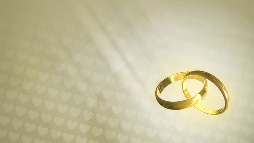 loopable animated background of three dimensional wedding rings revolving over a background of hearts - Wedding Ring Ceremony loopable animated background of three dimensional wedding rings revolving over a background of hearts - Wedding Ring Ceremony