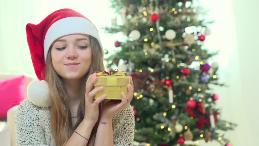 Hands Beautiful One Female Show Hold Get Gift Surprise Smile Hands Beautiful One Female Show Hold Get Gift Surprise Smile To Camera Christmas Tree In Red Beers Sweater On Bokeh Colorful Lights And Confetti