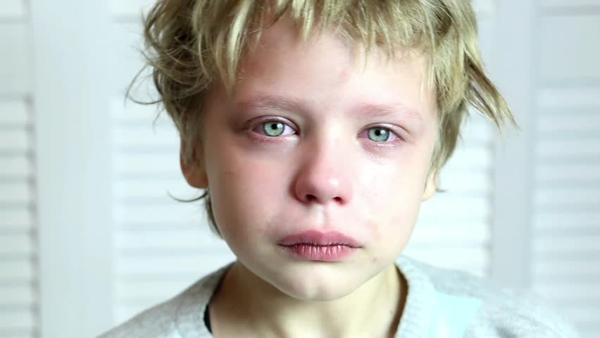 Cute Caucasian Blond Toddler Boy Portrait Crying At Home During