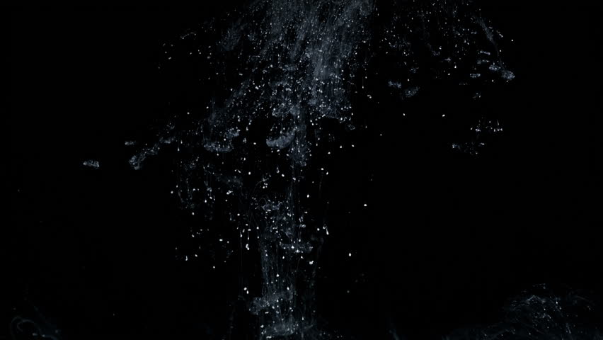 White Particles And Ink Slowly Moving In Water On Black Background ...